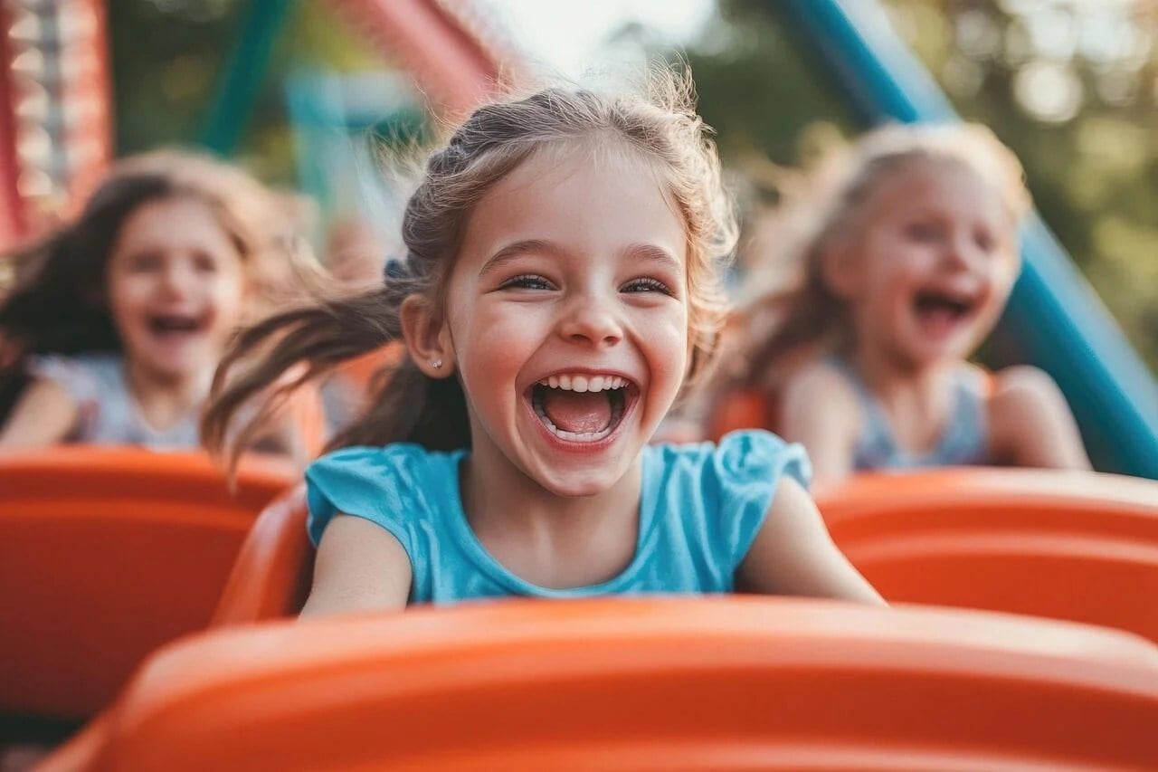 Children enjoying a roller coaster ride.